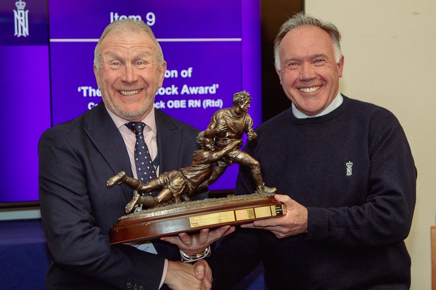 Gary Bushell (R) receiving the Chris Alcock Award presented by Chris for outstanding achievement in support of the RNRU.